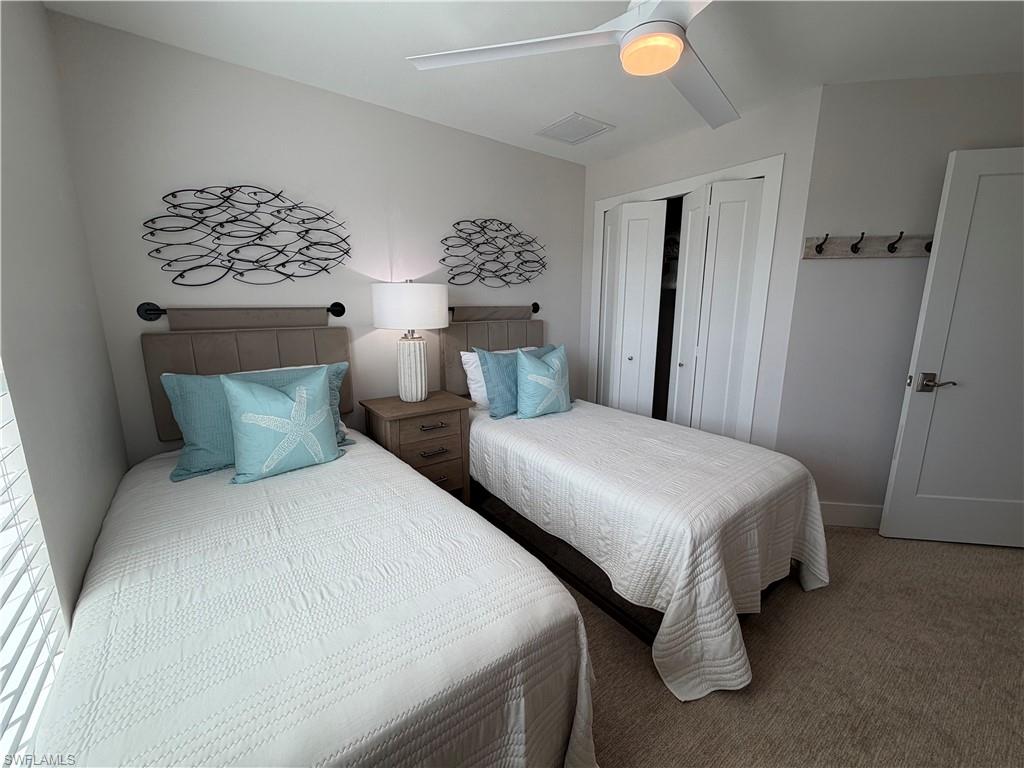 1727 Danford Street Naples, FL 34112 - Photo 11 of 15 a bedroom with a bed and lamp