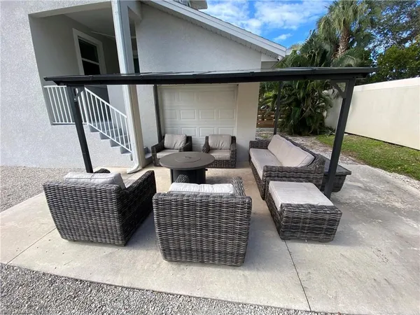 a balcony with furniture and wooden floor