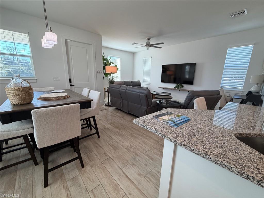 1727 Danford Street Naples, FL 34112 - Photo 4 of 15 a living room with furniture and a flat screen tv