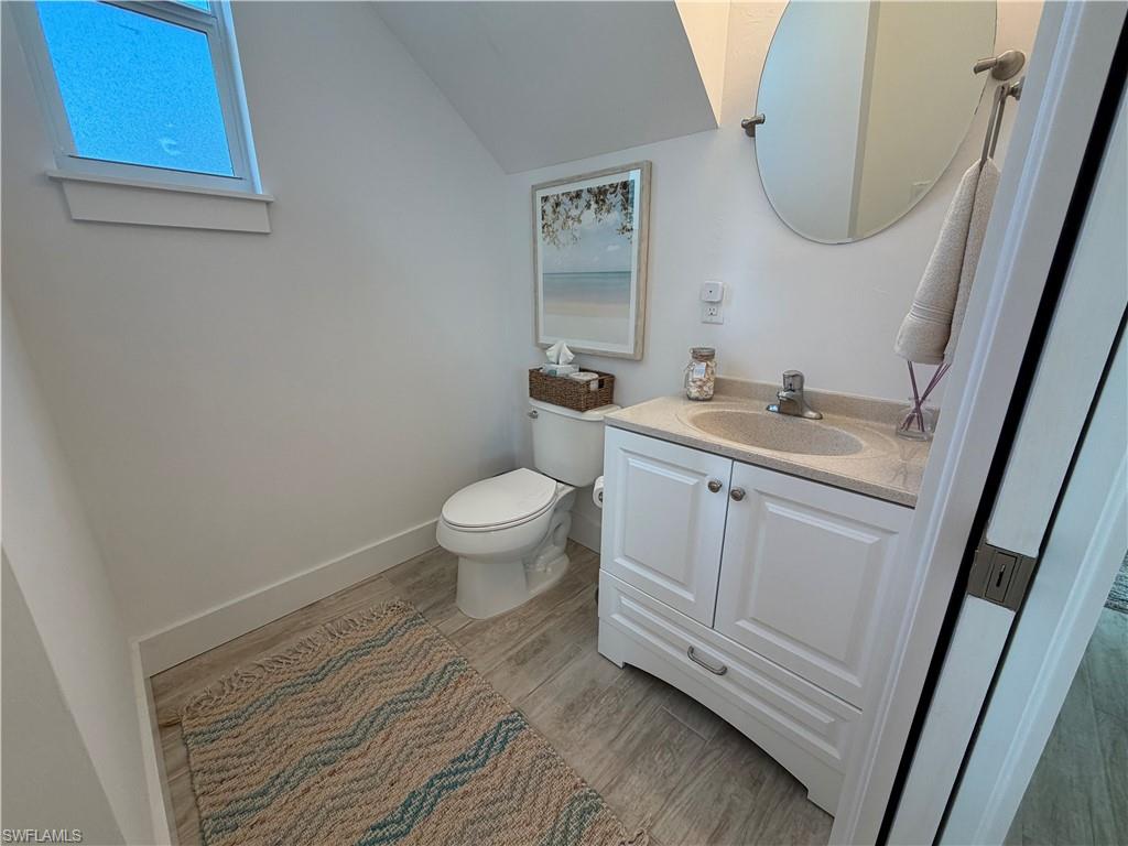 1727 Danford Street Naples, FL 34112 - Photo 6 of 15 a bathroom with a sink and a mirror