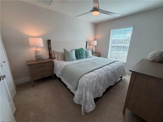 a bedroom with bed and window