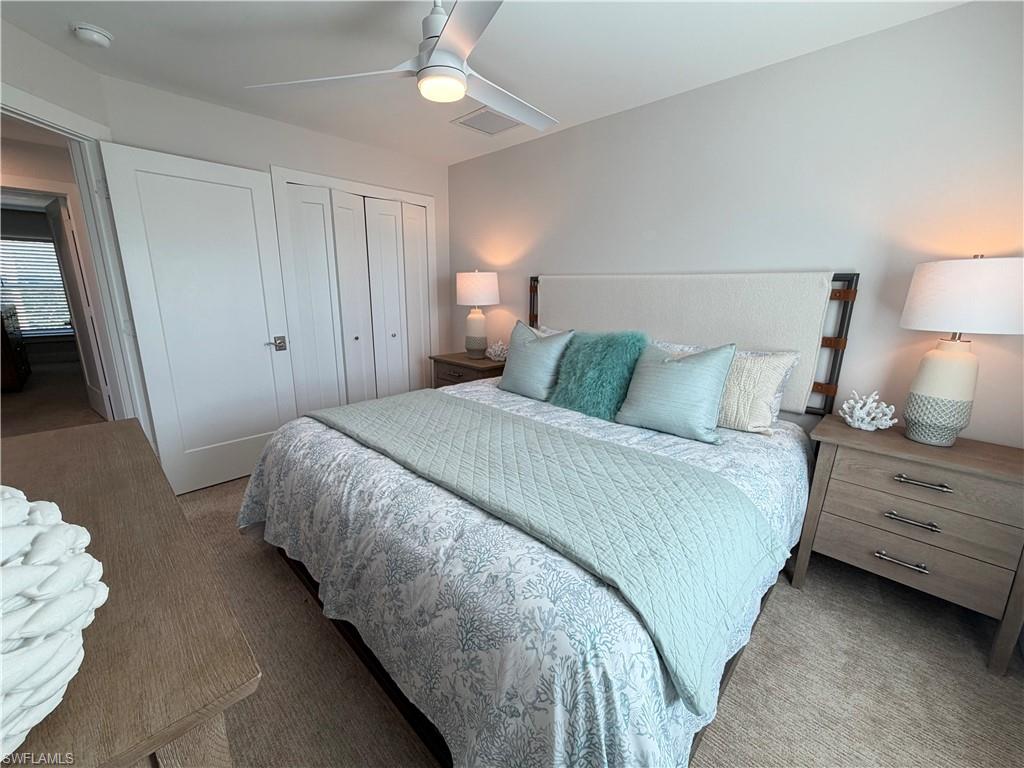 1727 Danford Street Naples, FL 34112 - Photo 8 of 15 a bedroom with a bed and a lamp