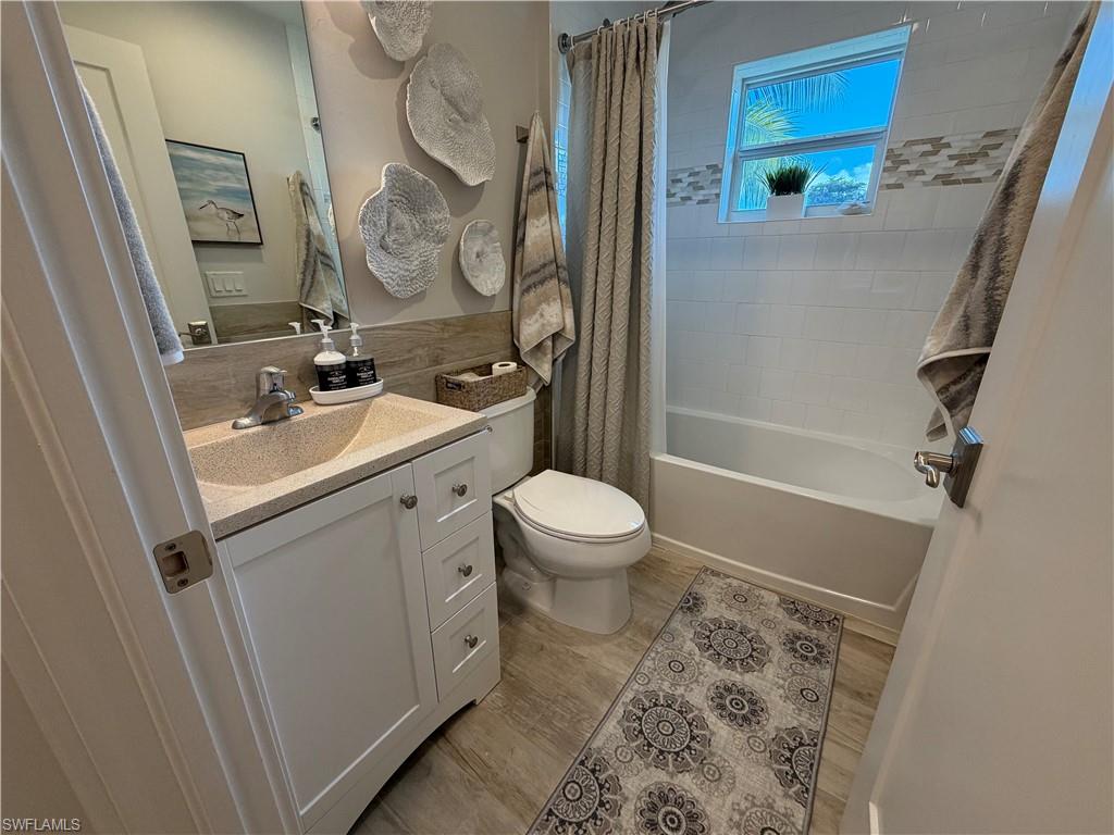 1727 Danford Street Naples, FL 34112 - Photo 9 of 15 a bathroom with a sink a toilet and shower
