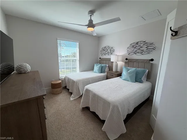 a bedroom with bed and window