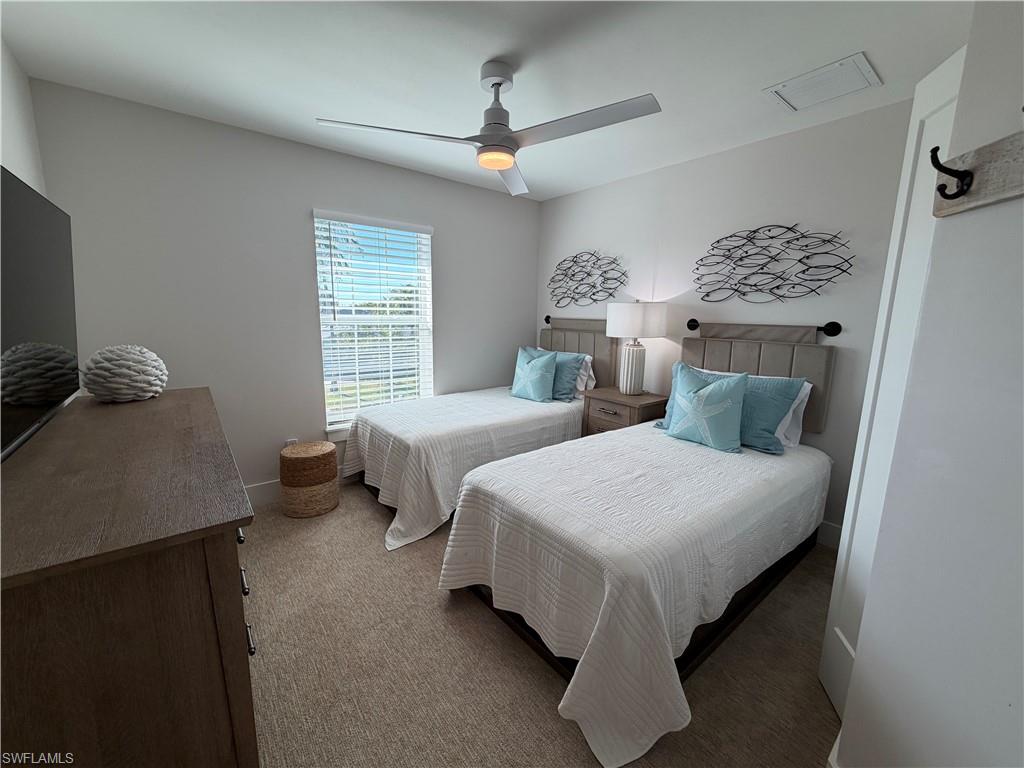1727 Danford Street Naples, FL 34112 - Photo 10 of 15 a bedroom with bed and window