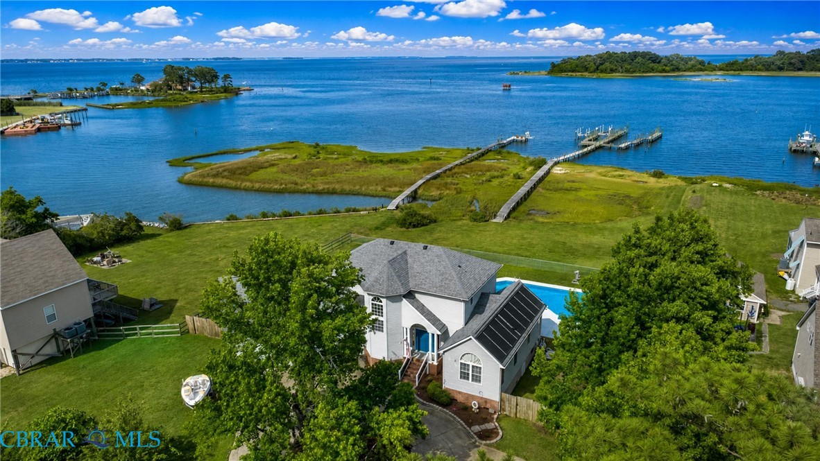 1214 Dandy Loop Road Yorktown, VA 23692 - Photo 12 of 65 an aerial view of a house with a garden and lake view