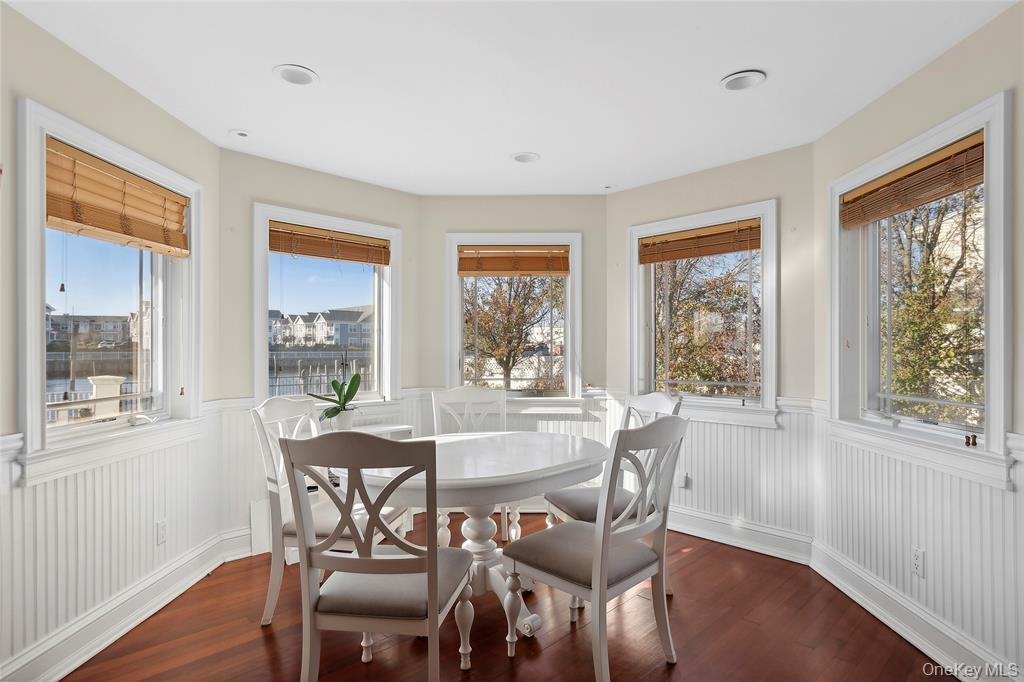 4 Quebec Road Island Park, NY 11558 - Photo 6 of 24 a view of a dining room with furniture window and wooden floor