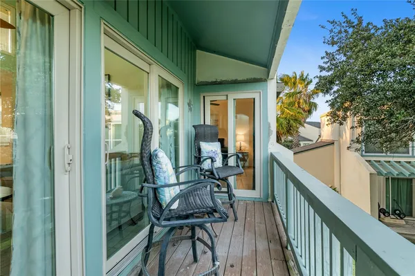 a view of balcony with furniture