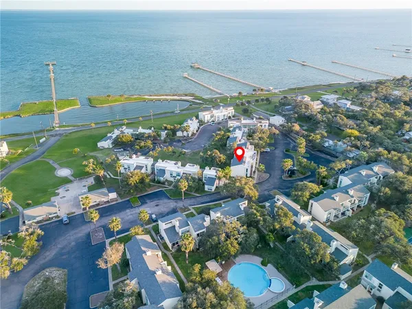 a view of walk in closet and wooden floor