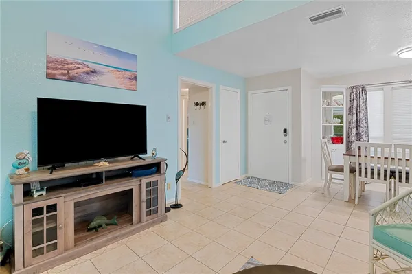 a view of living room with furniture and flat screen tv