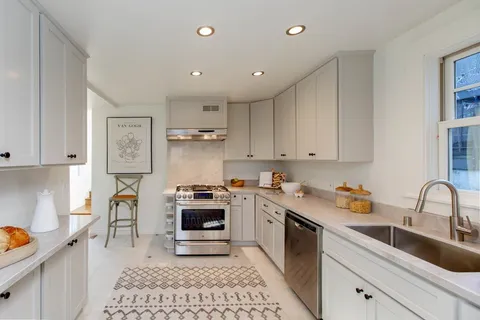 a spacious bedroom with a bed and window