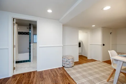 a view of a patio with a table chairs and a backyard