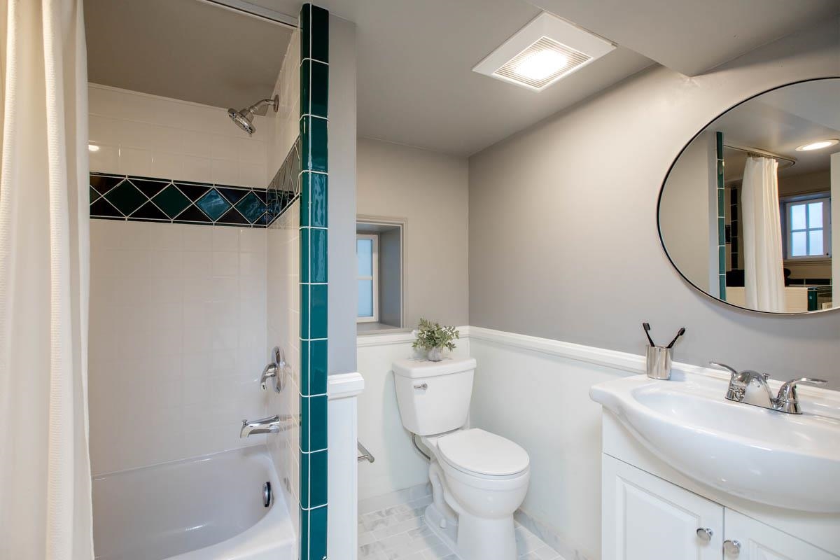 1427 Bay Street Alameda, CA 94501 - Photo 34 of 60 a bathroom with a sink toilet and shower