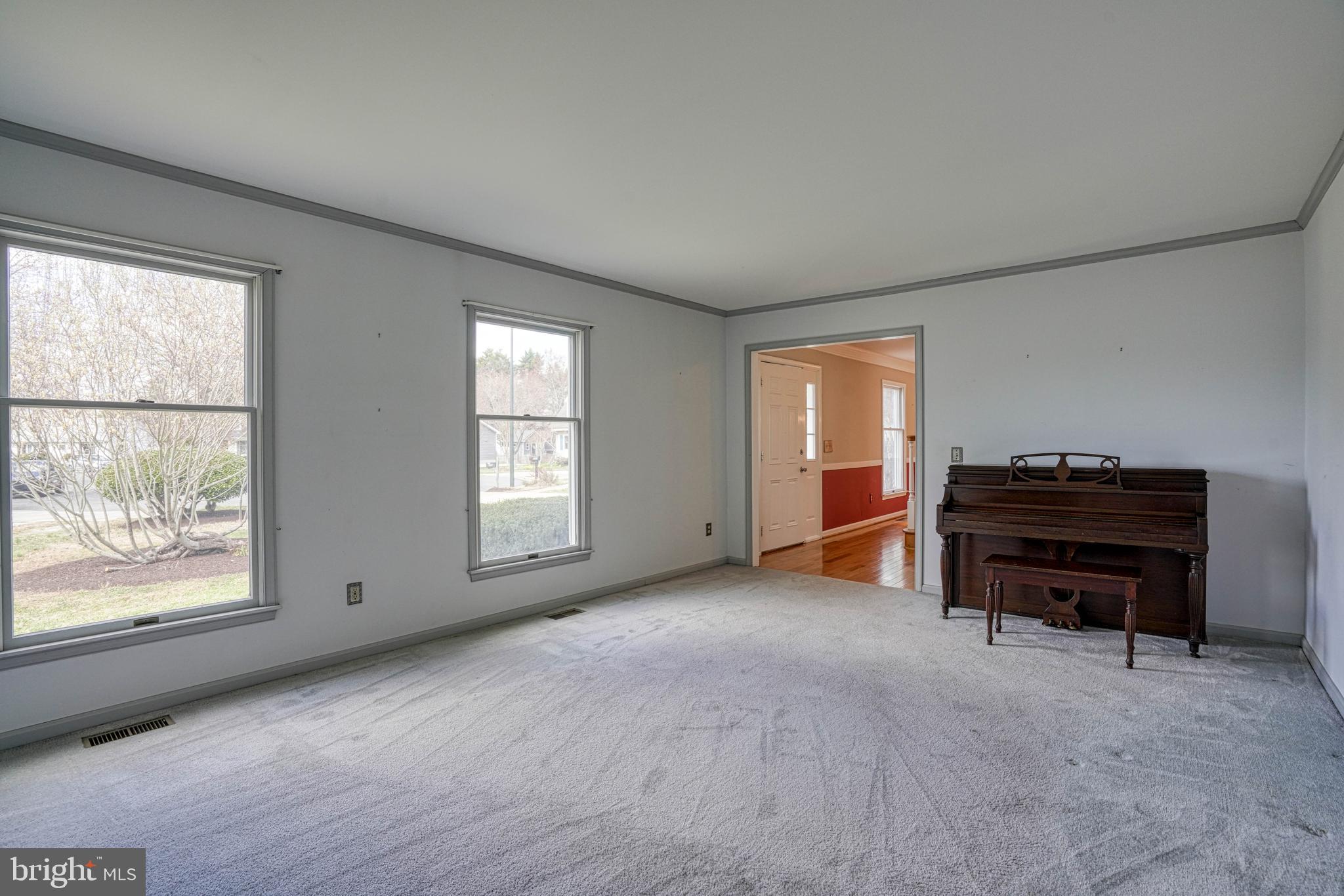 200 Spring Drive Easton, MD 21601 - Photo 14 of 54 a view of a room with gym equipment and windows