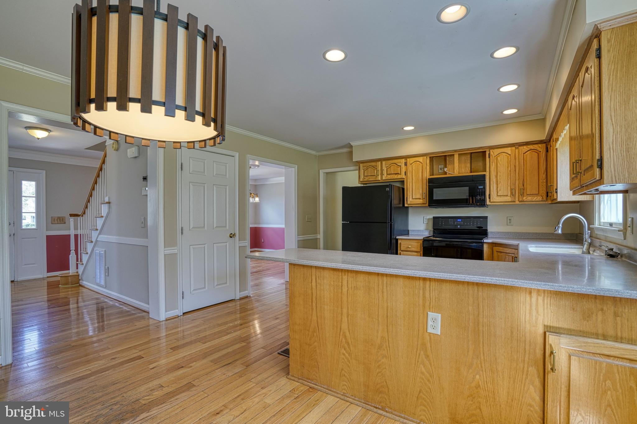 200 Spring Drive Easton, MD 21601 - Photo 22 of 54 a kitchen with stainless steel appliances granite countertop a sink a stove and a refrigerator