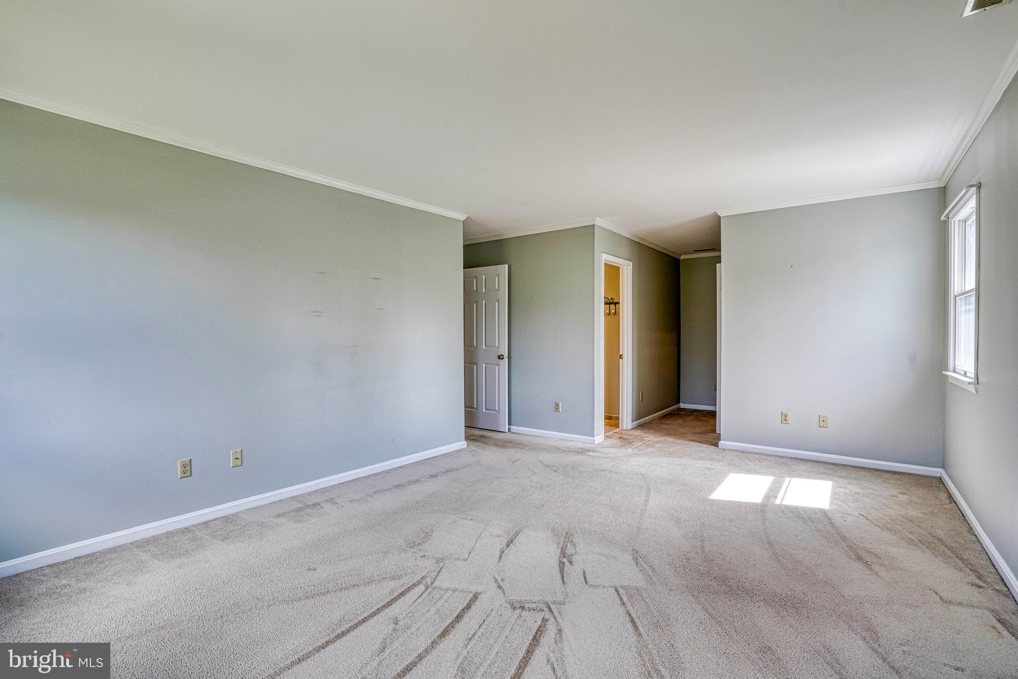 200 Spring Drive Easton, MD 21601 - Photo 29 of 54 an empty room with windows and closet