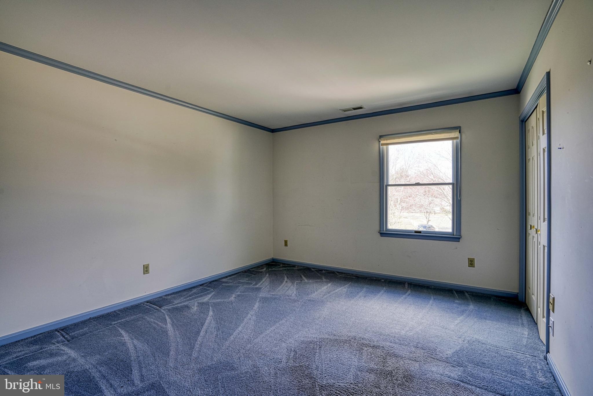 200 Spring Drive Easton, MD 21601 - Photo 43 of 54 an empty room with a empty space and windows