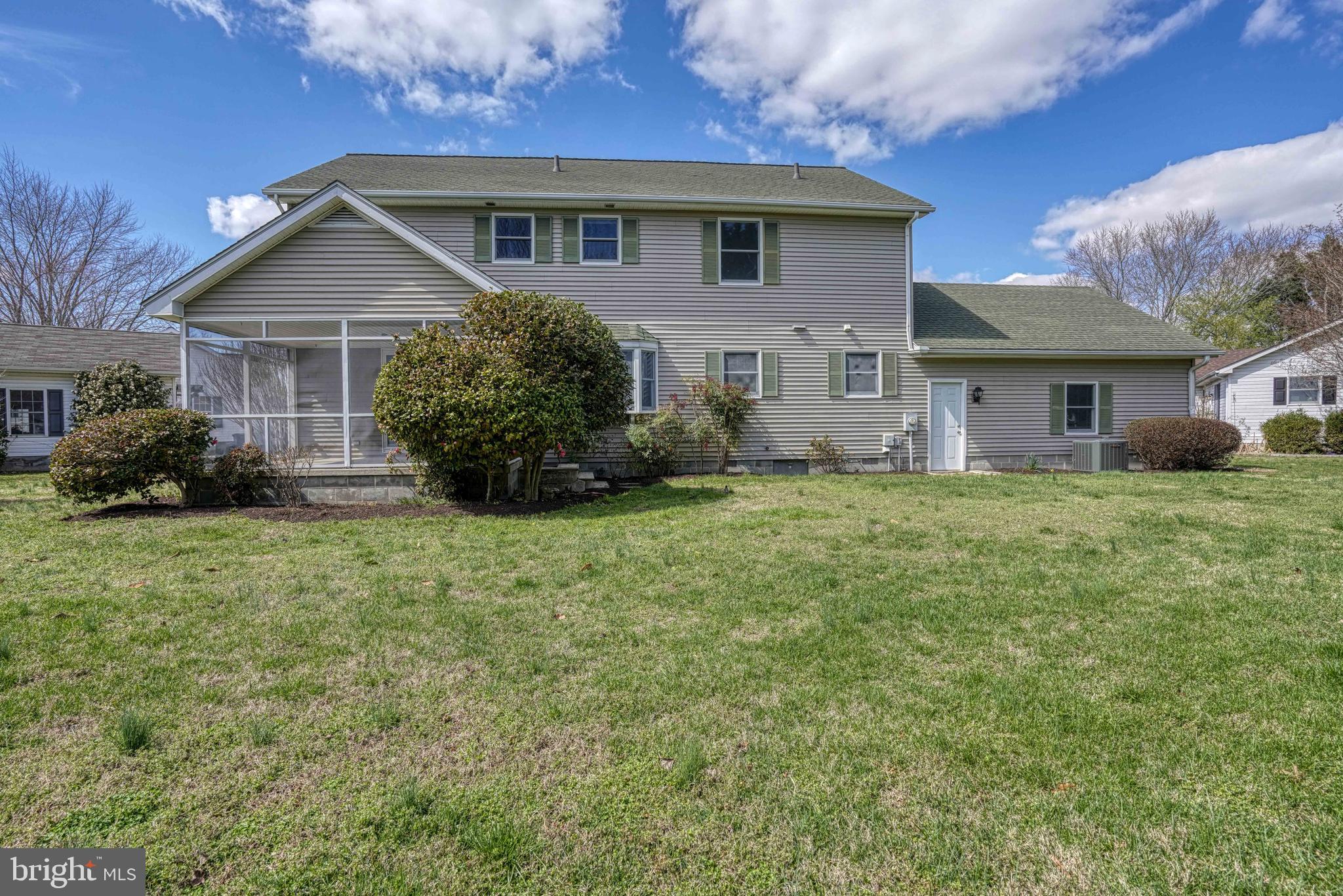 200 Spring Drive Easton, MD 21601 - Photo 50 of 54 a front view of a house with garden