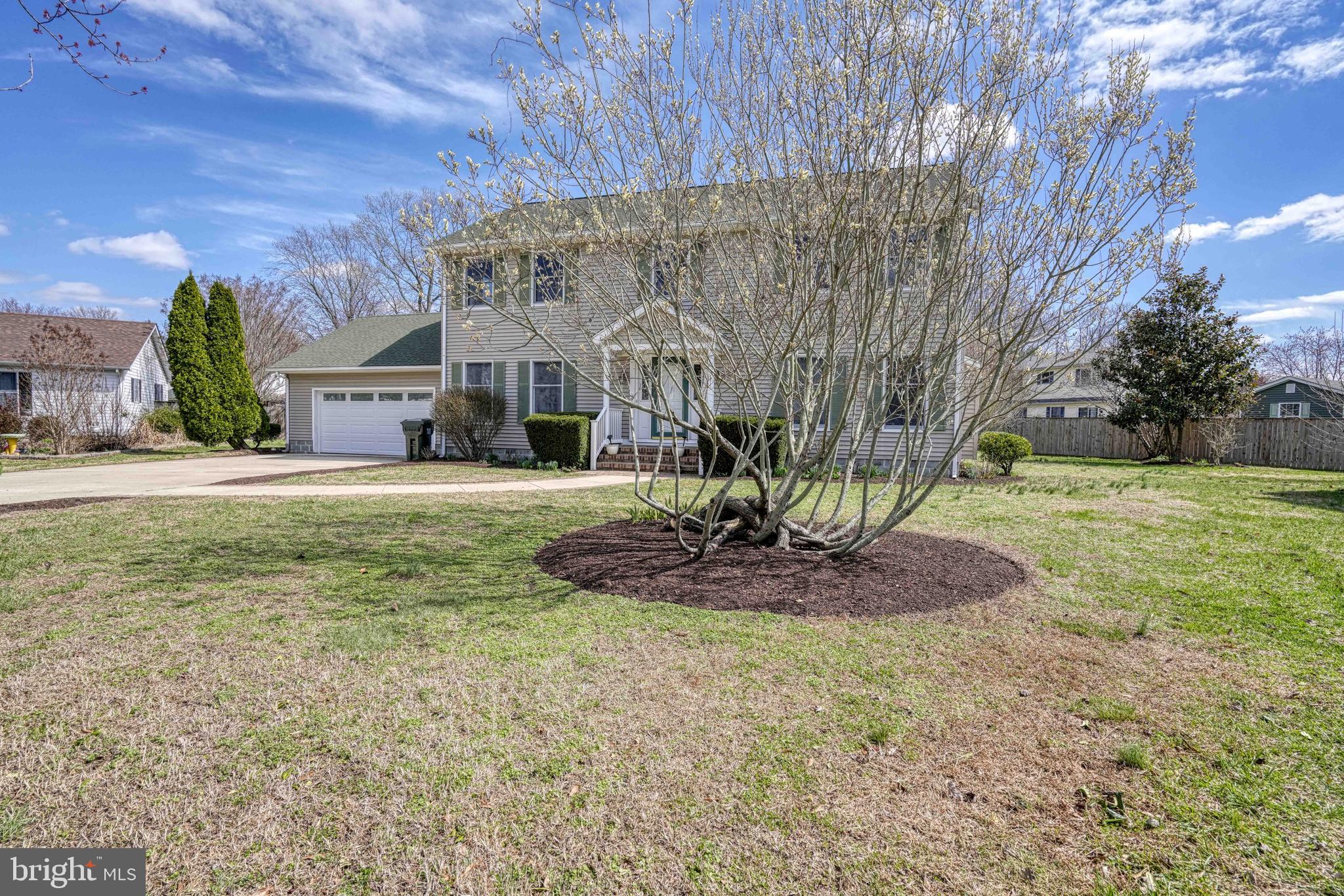 200 Spring Drive Easton, MD 21601 - Photo 5 of 54 a front view of a house with a yard