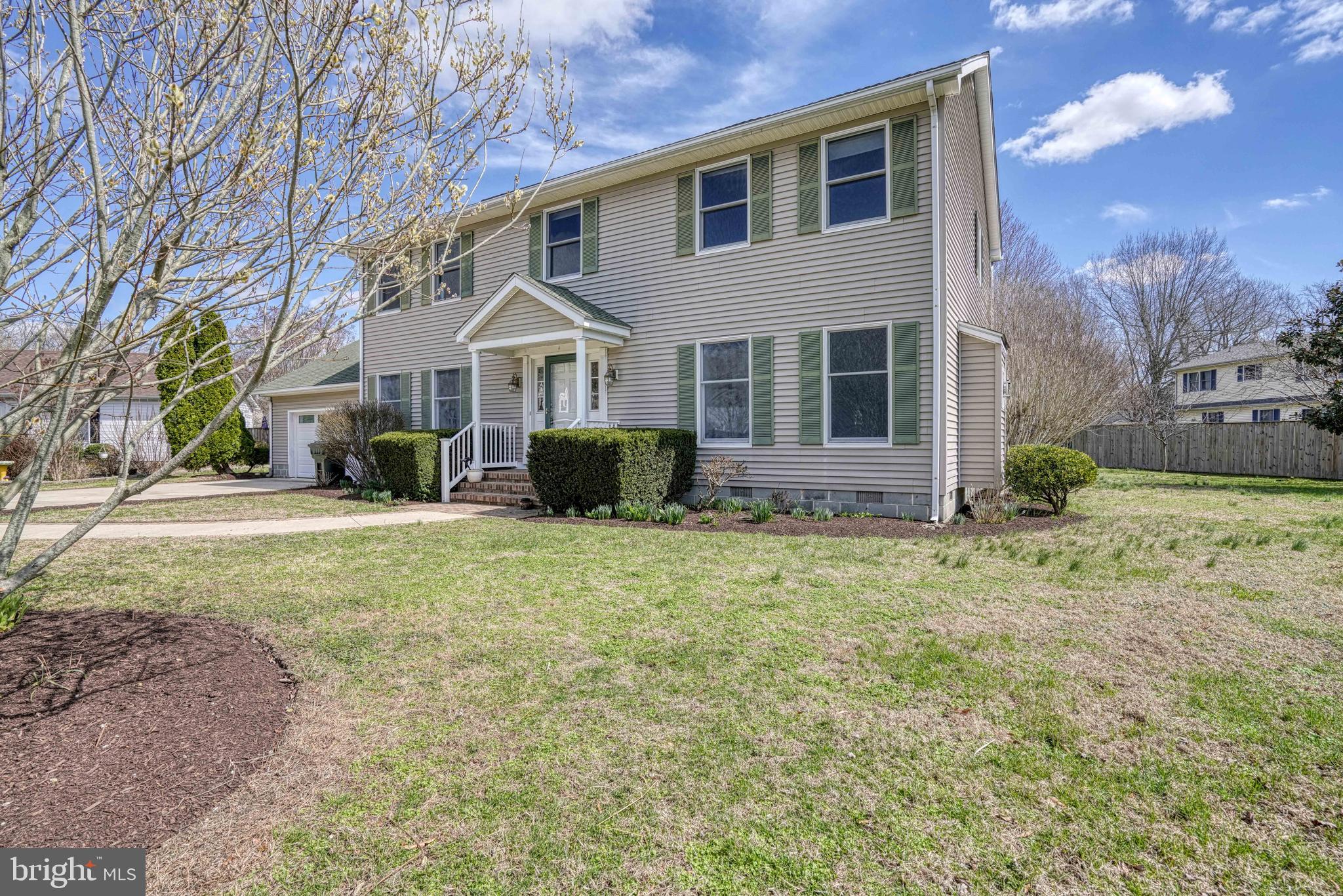 200 Spring Drive Easton, MD 21601 - Photo 6 of 54 a front view of house with yard and trees around