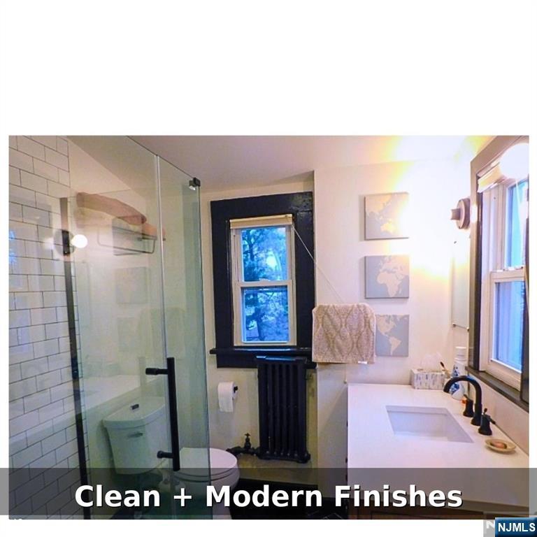 10 Fairview Place Bloomfield, NJ 07003 - Photo 18 of 20 a bathroom with a sink and a mirror