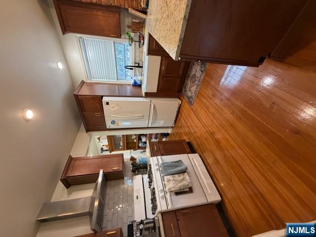 10 Fairview Place Bloomfield, NJ 07003 - Photo 4 of 20 a kitchen with a stove a refrigerator and cabinets