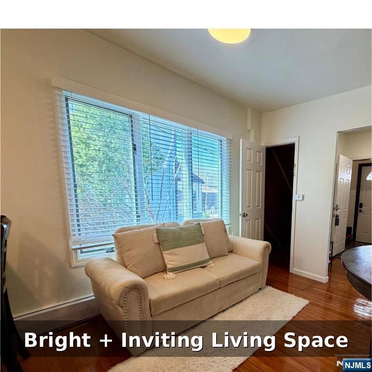10 Fairview Place Bloomfield, NJ 07003 - Photo 7 of 20 a living room with furniture and a floor to ceiling window