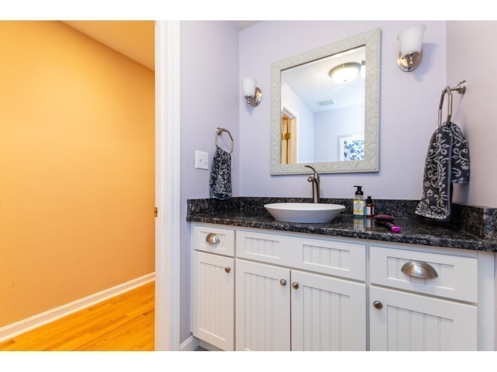 25 Upson Road Wellesley, MA 02482 - Photo 13 of 32 a bathroom with a sink and a mirror