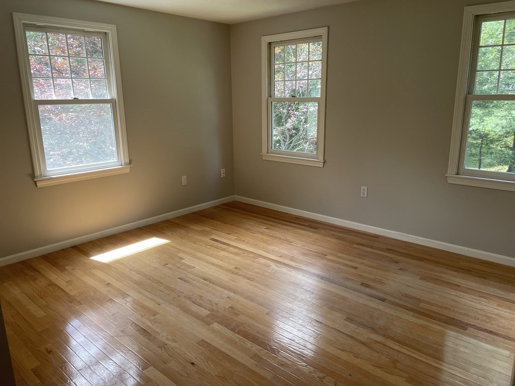 25 Upson Road Wellesley, MA 02482 - Photo 17 of 32 a view of an empty room with wooden floor and a window