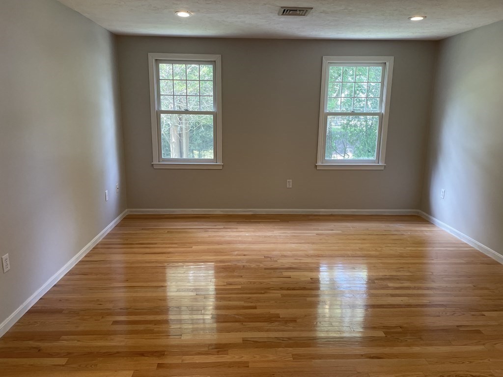 25 Upson Road Wellesley, MA 02482 - Photo 18 of 32 a view of empty room with wooden floor and window