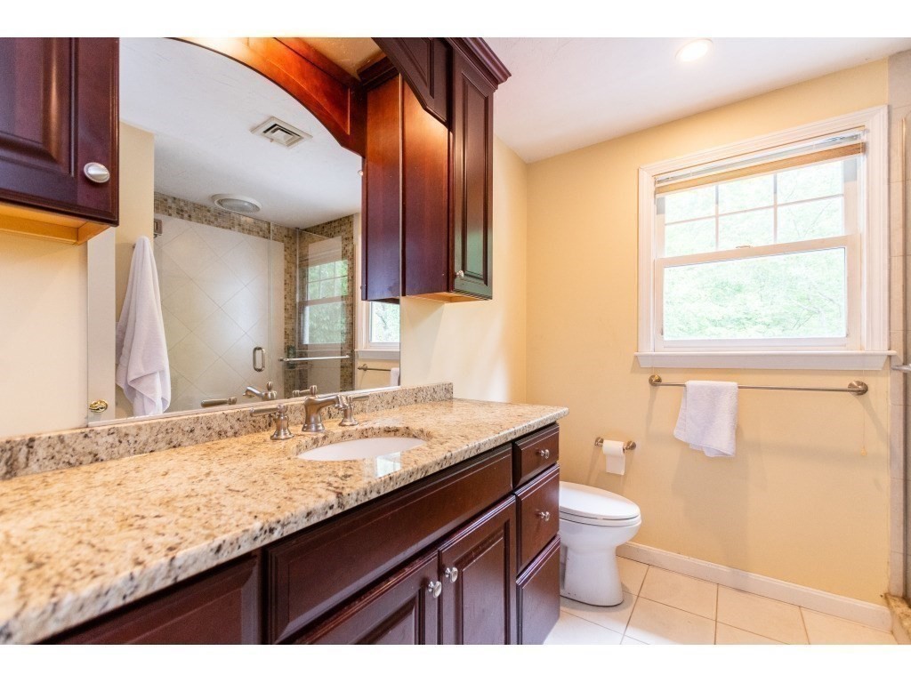 25 Upson Road Wellesley, MA 02482 - Photo 22 of 32 a bathroom with a granite countertop sink toilet and shower