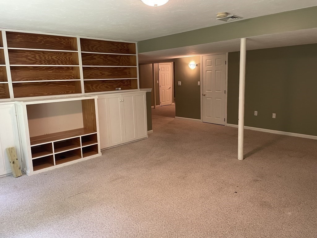 25 Upson Road Wellesley, MA 02482 - Photo 23 of 32 a view of an empty room with empty shelves