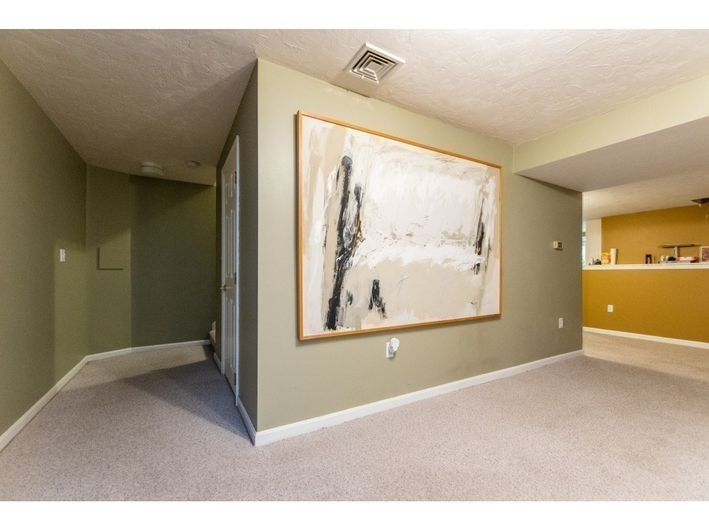 25 Upson Road Wellesley, MA 02482 - Photo 26 of 32 an empty room with windows and painted walls