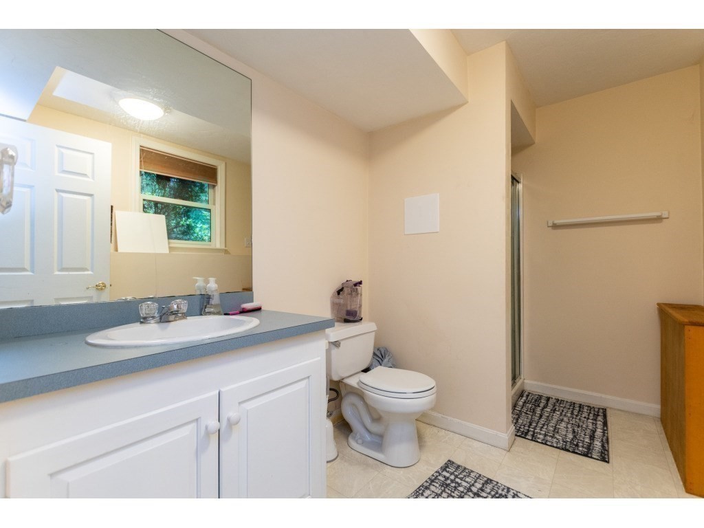 25 Upson Road Wellesley, MA 02482 - Photo 27 of 32 a bathroom with a granite countertop sink toilet and mirror