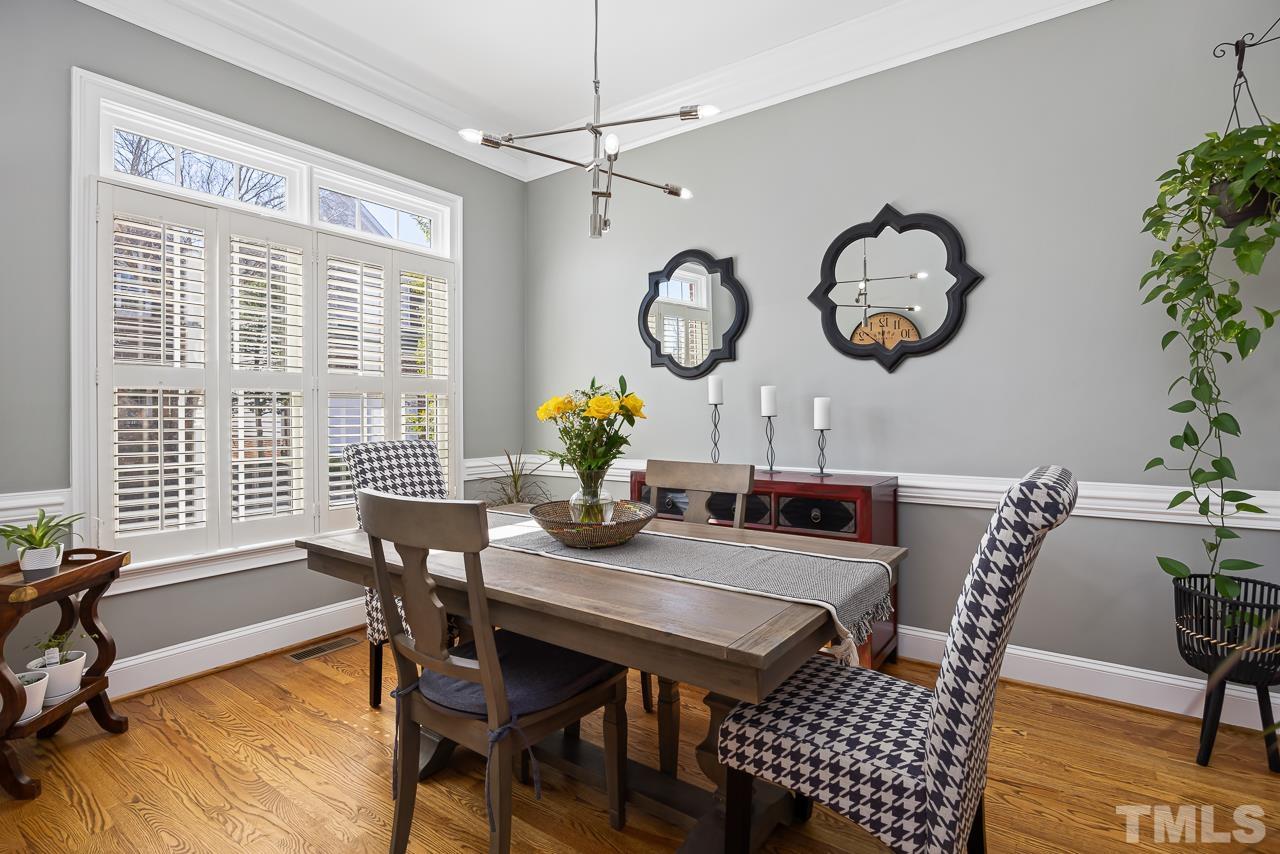 3948 Bentley Bridge Road Raleigh, NC 27612 - Photo 5 of 27 a view of a dining room with furniture window and wooden floor