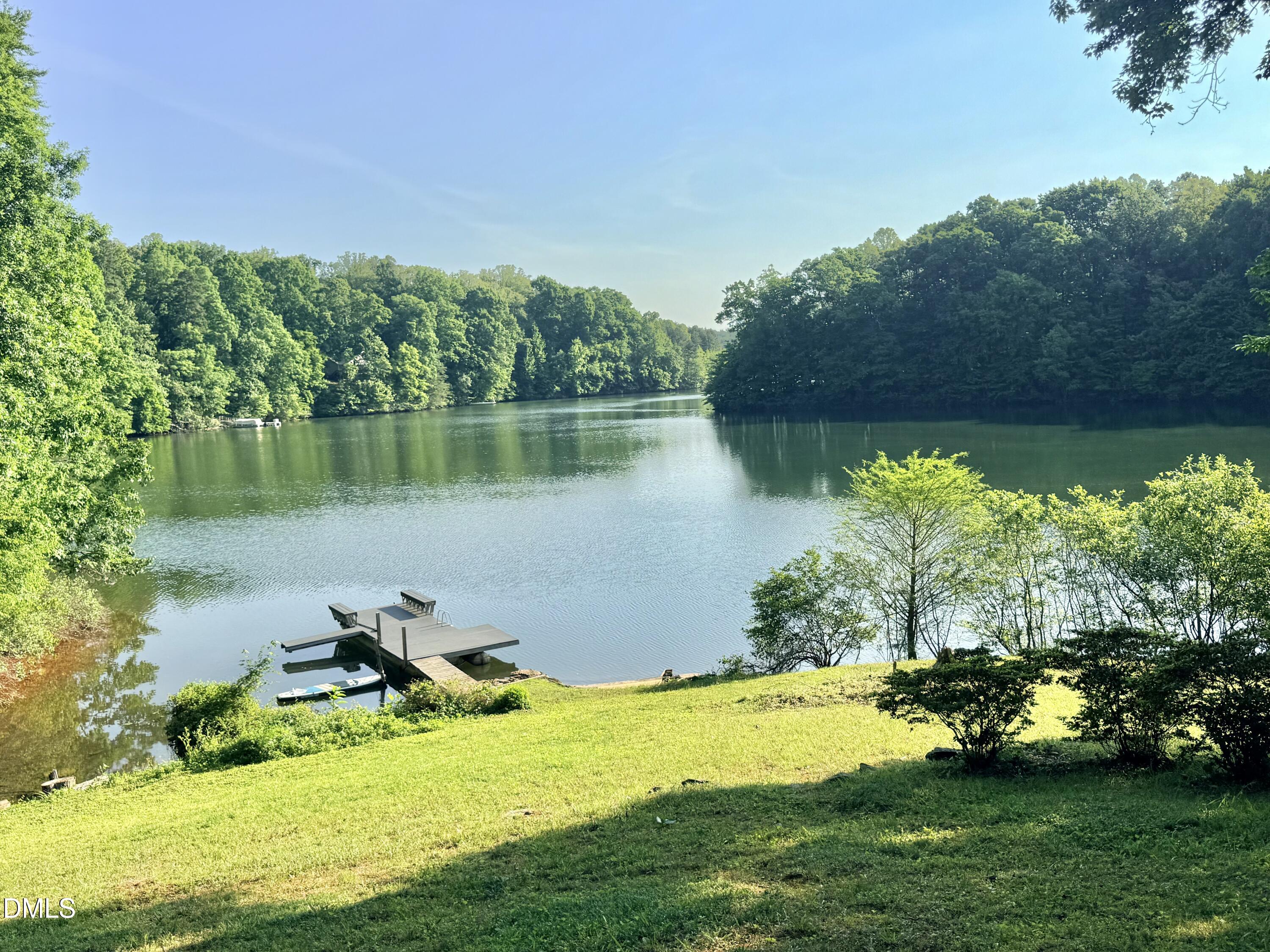 81 Beaver Crossing Road Roxboro, NC 27574 - Photo 76 of 80 a view of a lake with a yard