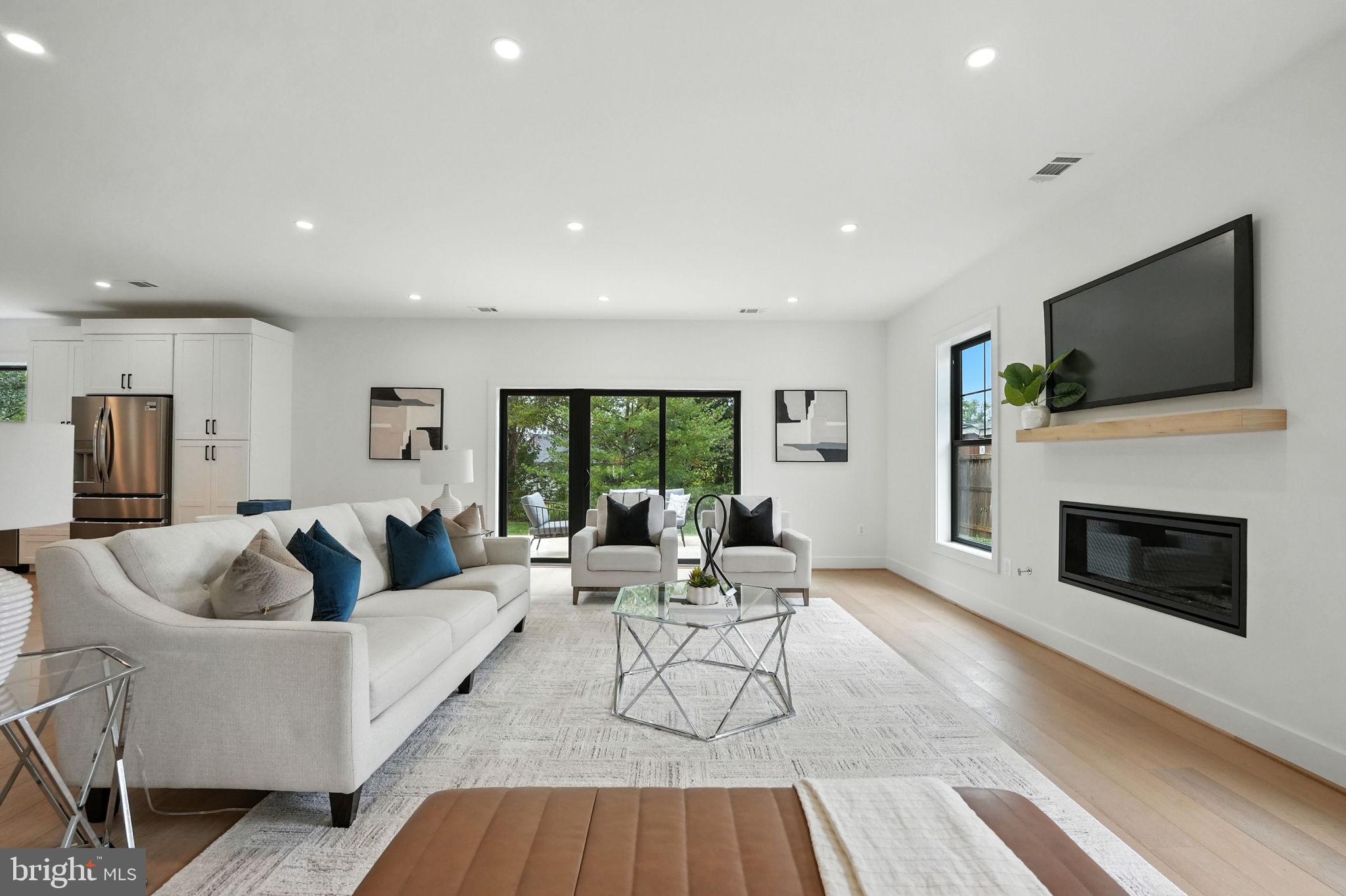 8118 Drayton Lane Springfield, VA 22151 - Photo 15 of 71 a living room with fireplace furniture and a flat screen tv