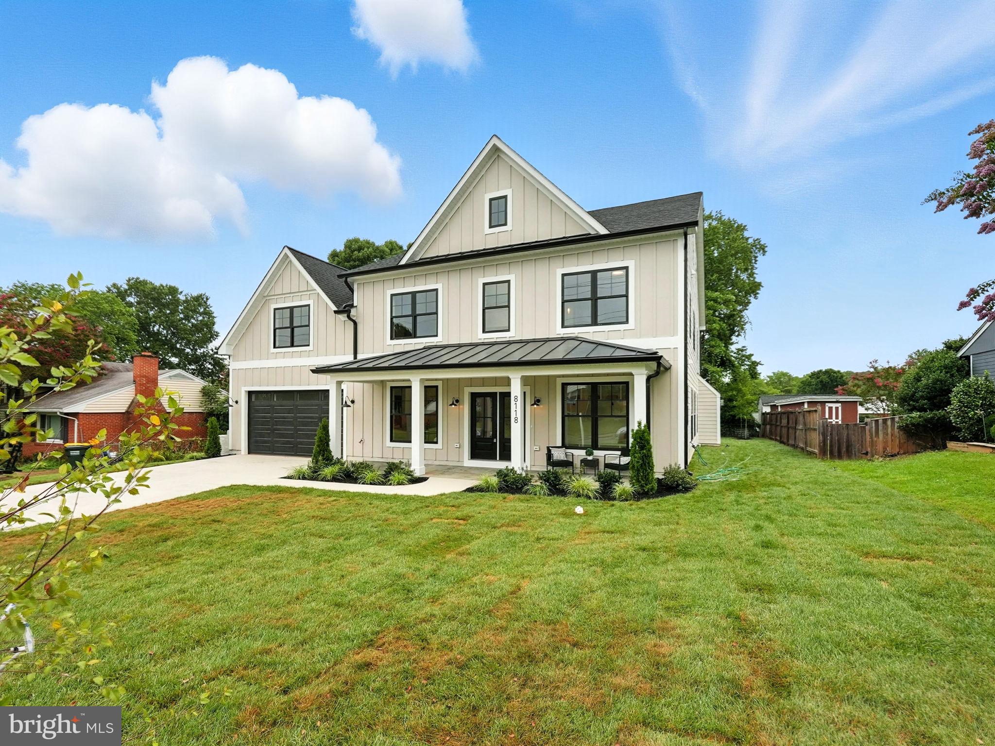 8118 Drayton Lane Springfield, VA 22151 - Photo 2 of 71 a front view of a house with a yard