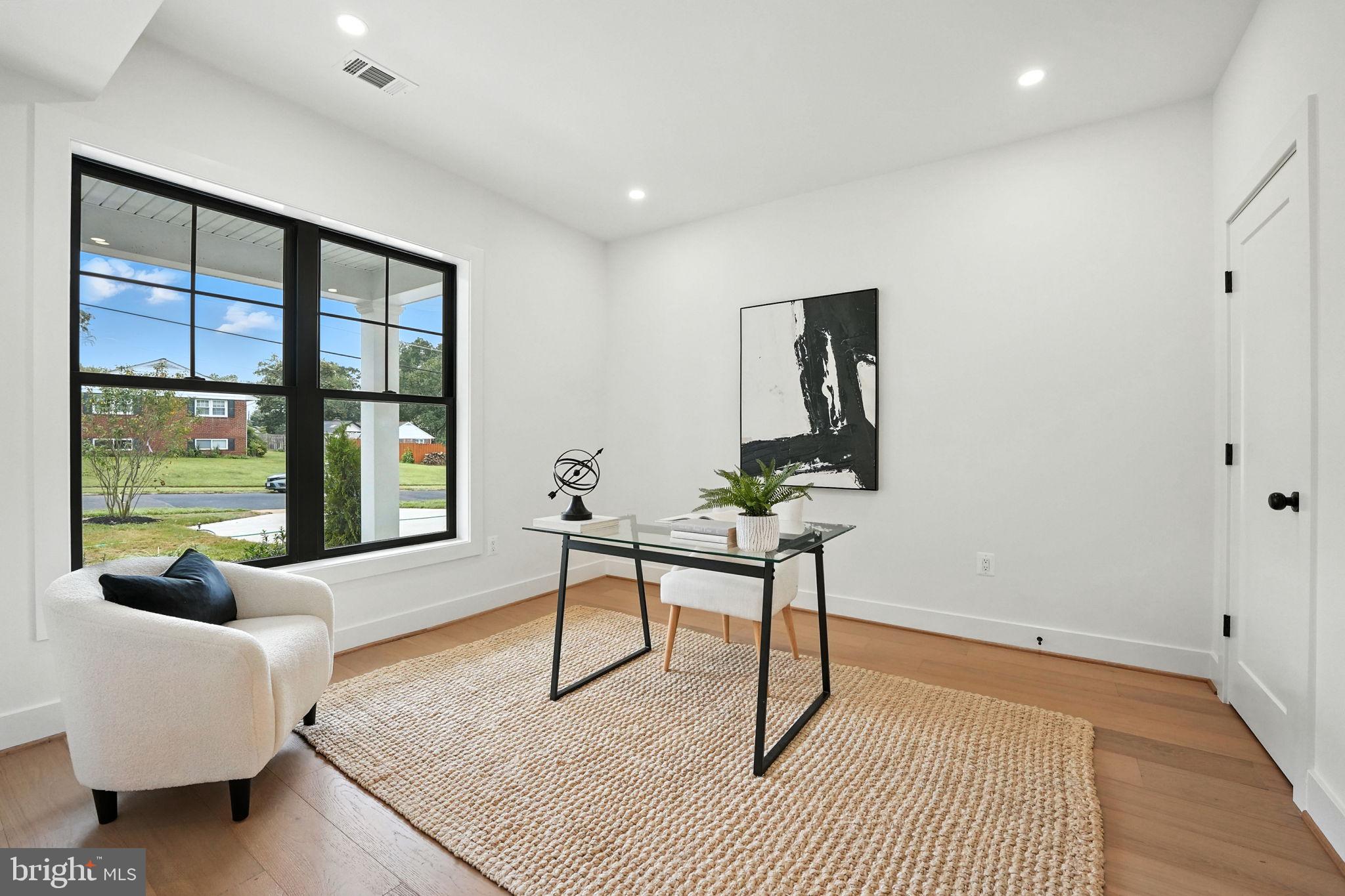 8118 Drayton Lane Springfield, VA 22151 - Photo 28 of 71 a living room with furniture and a window