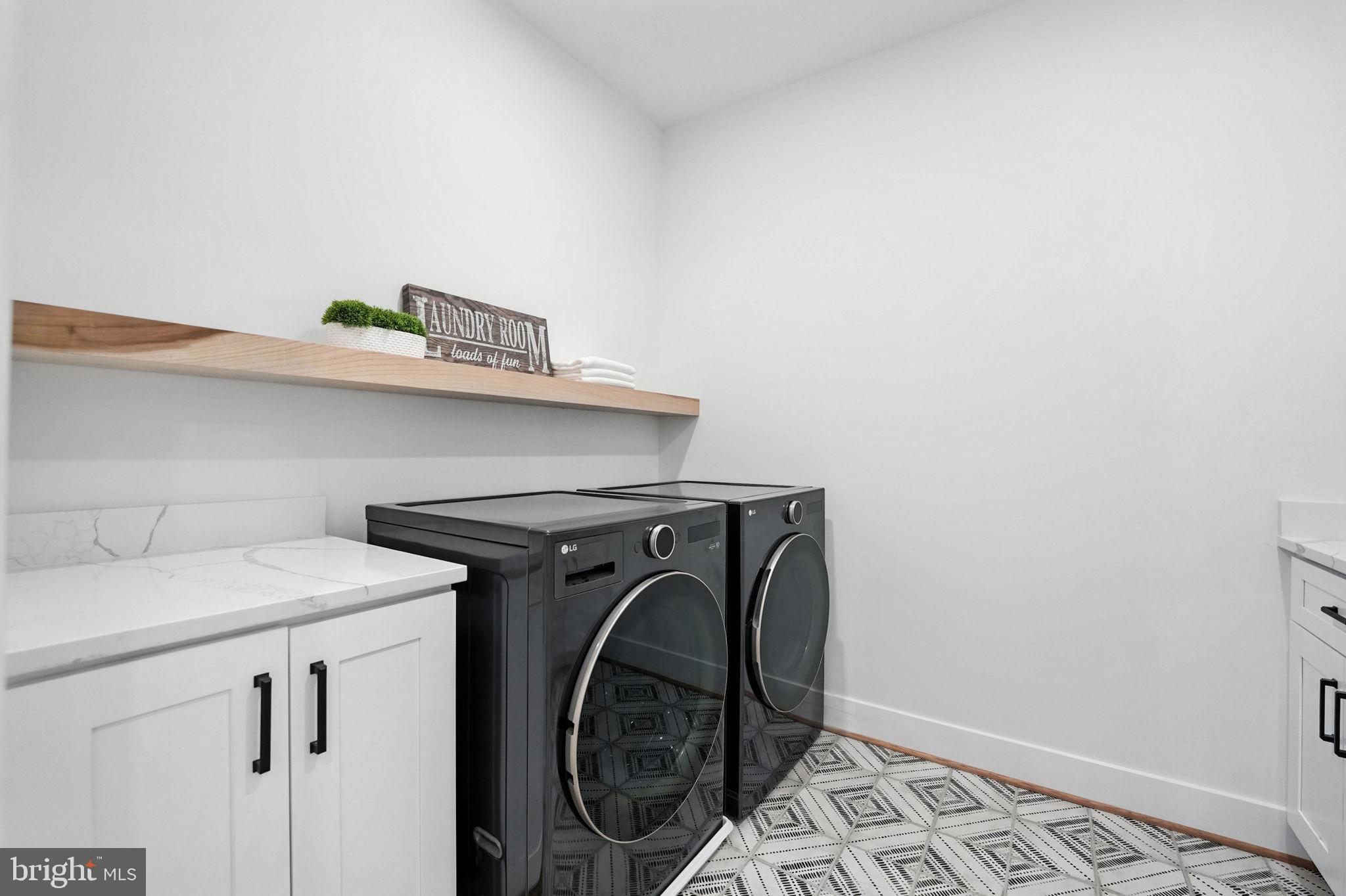 8118 Drayton Lane Springfield, VA 22151 - Photo 36 of 71 a utility room with dryer and washer