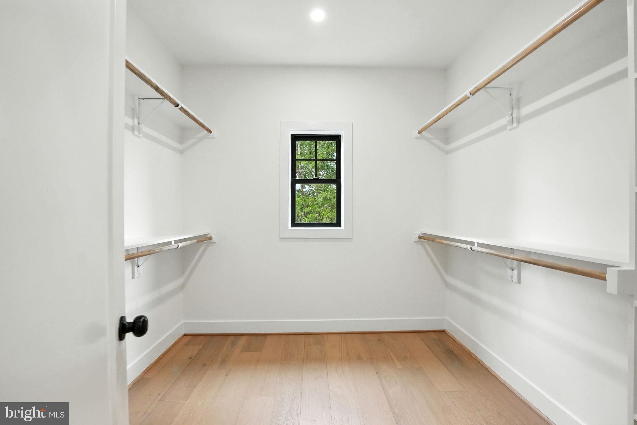 8118 Drayton Lane Springfield, VA 22151 - Photo 40 of 71 a view of a room with rack on the wall and a window