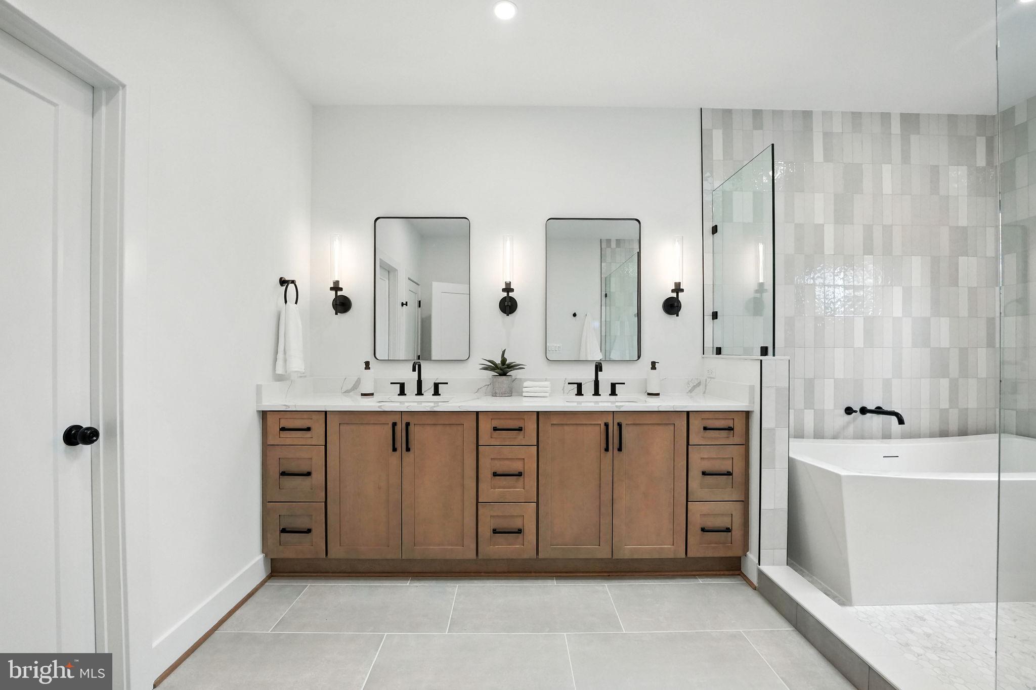 8118 Drayton Lane Springfield, VA 22151 - Photo 43 of 71 a spacious bathroom with a double vanity sink mirror and double