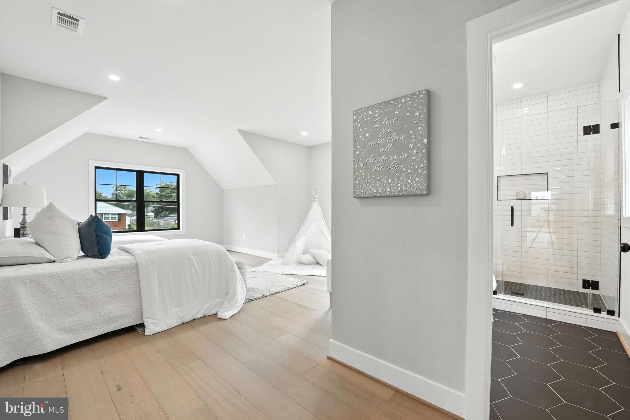 8118 Drayton Lane Springfield, VA 22151 - Photo 48 of 71 a bedroom with a bed and wooden floor