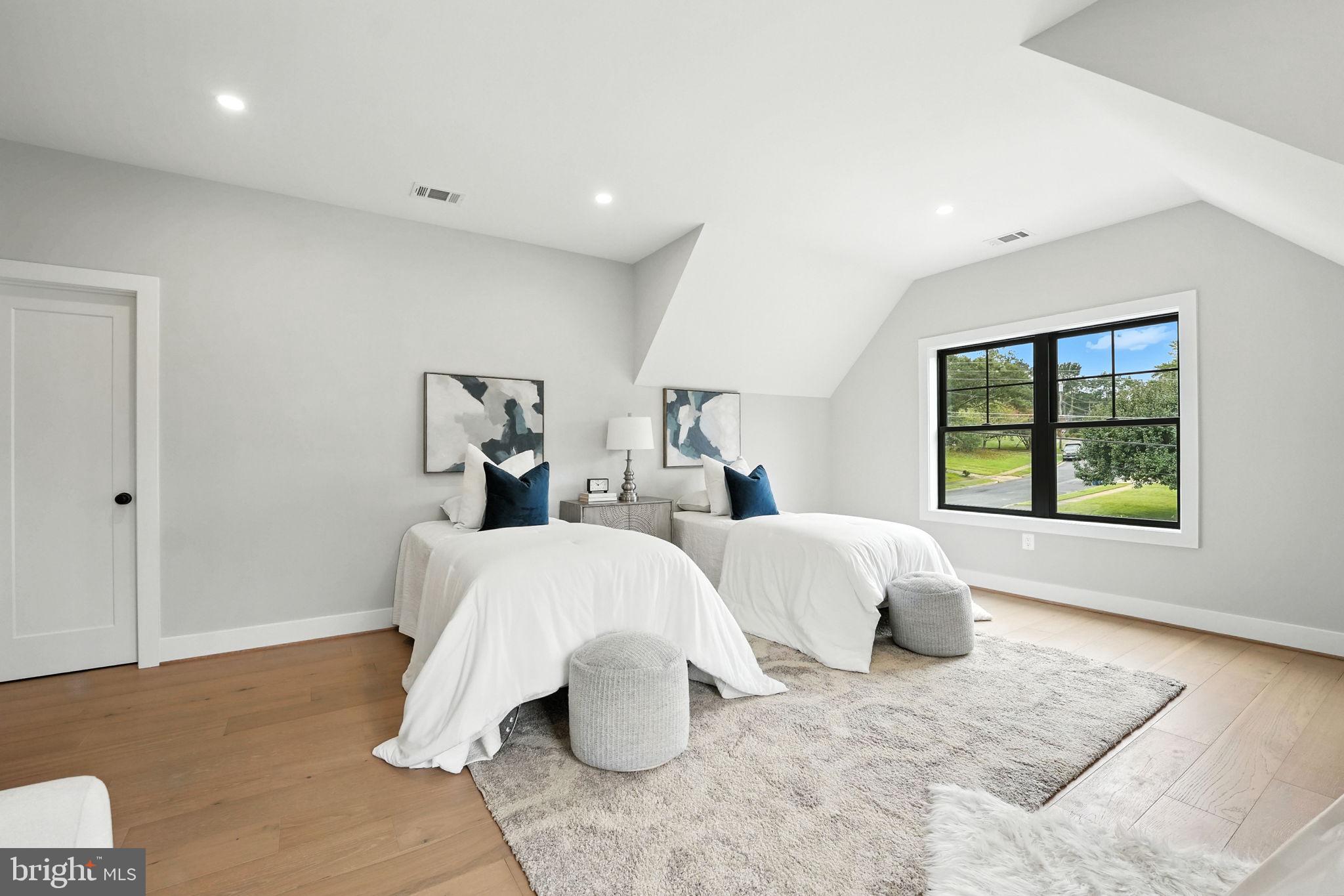 8118 Drayton Lane Springfield, VA 22151 - Photo 50 of 71 a spacious bedroom with two beds and large window
