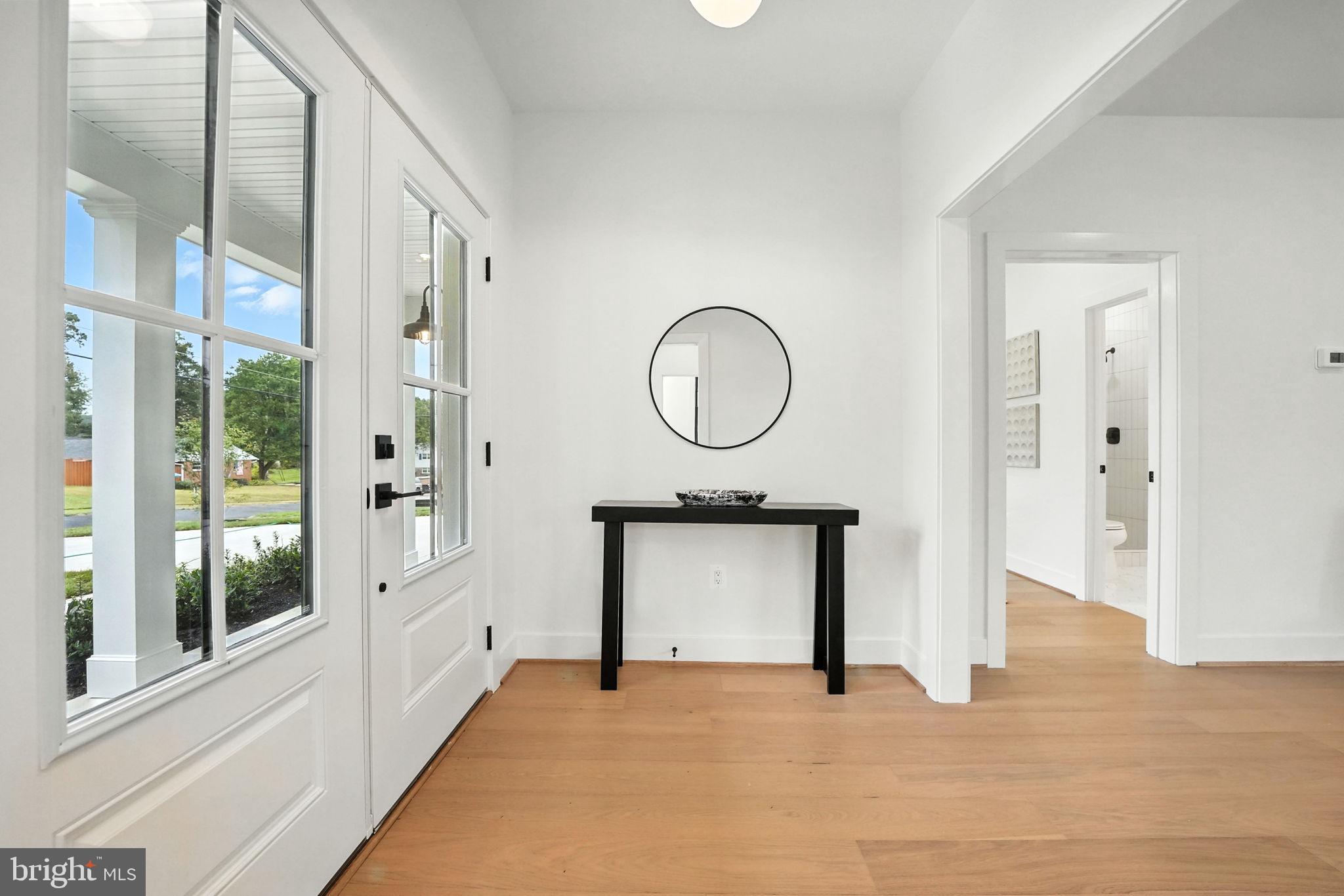 8118 Drayton Lane Springfield, VA 22151 - Photo 5 of 71 a view of a room with wooden floor and a large window