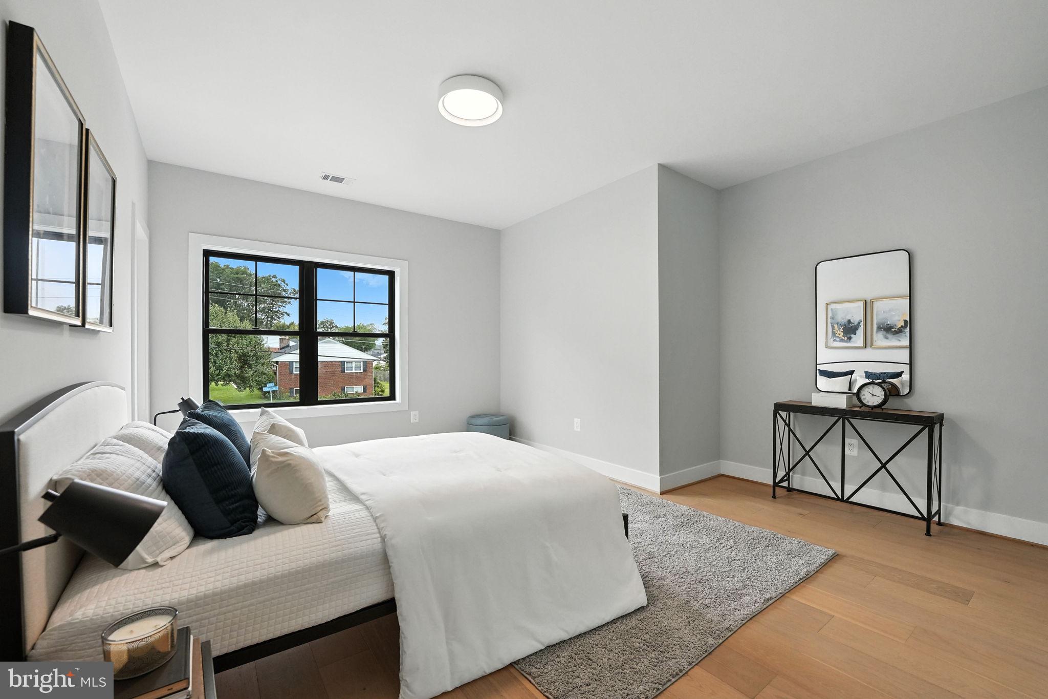 8118 Drayton Lane Springfield, VA 22151 - Photo 53 of 71 a bedroom with a bed and window