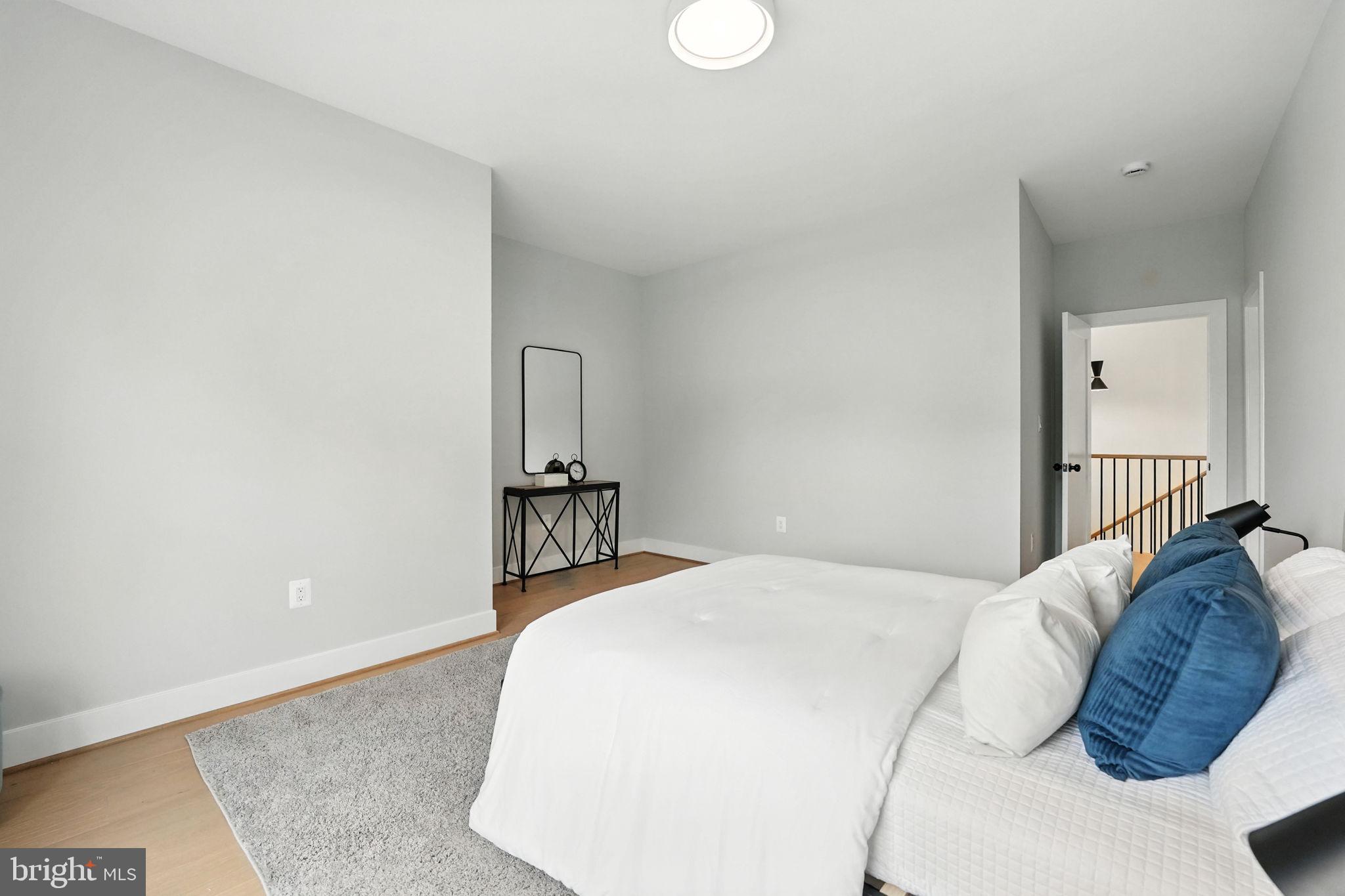 8118 Drayton Lane Springfield, VA 22151 - Photo 55 of 71 a bedroom with a bed and a painting on the wall