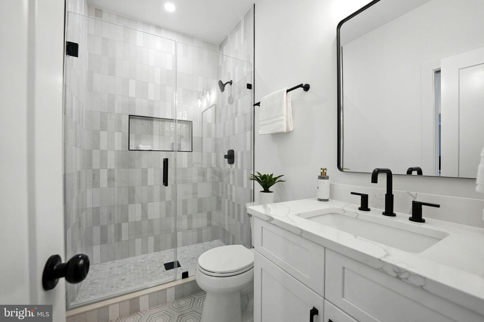 8118 Drayton Lane Springfield, VA 22151 - Photo 57 of 71 a bathroom with a sink toilet and shower