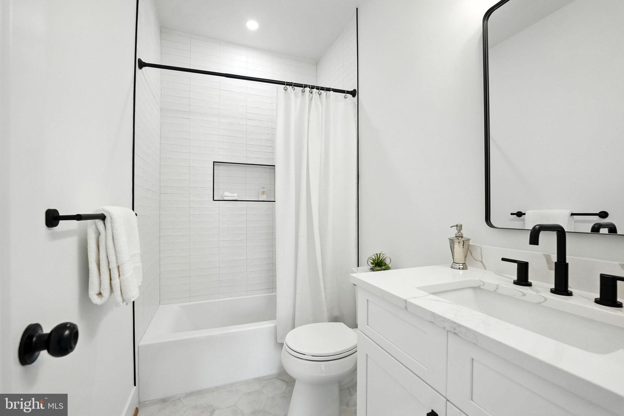 8118 Drayton Lane Springfield, VA 22151 - Photo 64 of 71 a bathroom with a sink toilet and shower