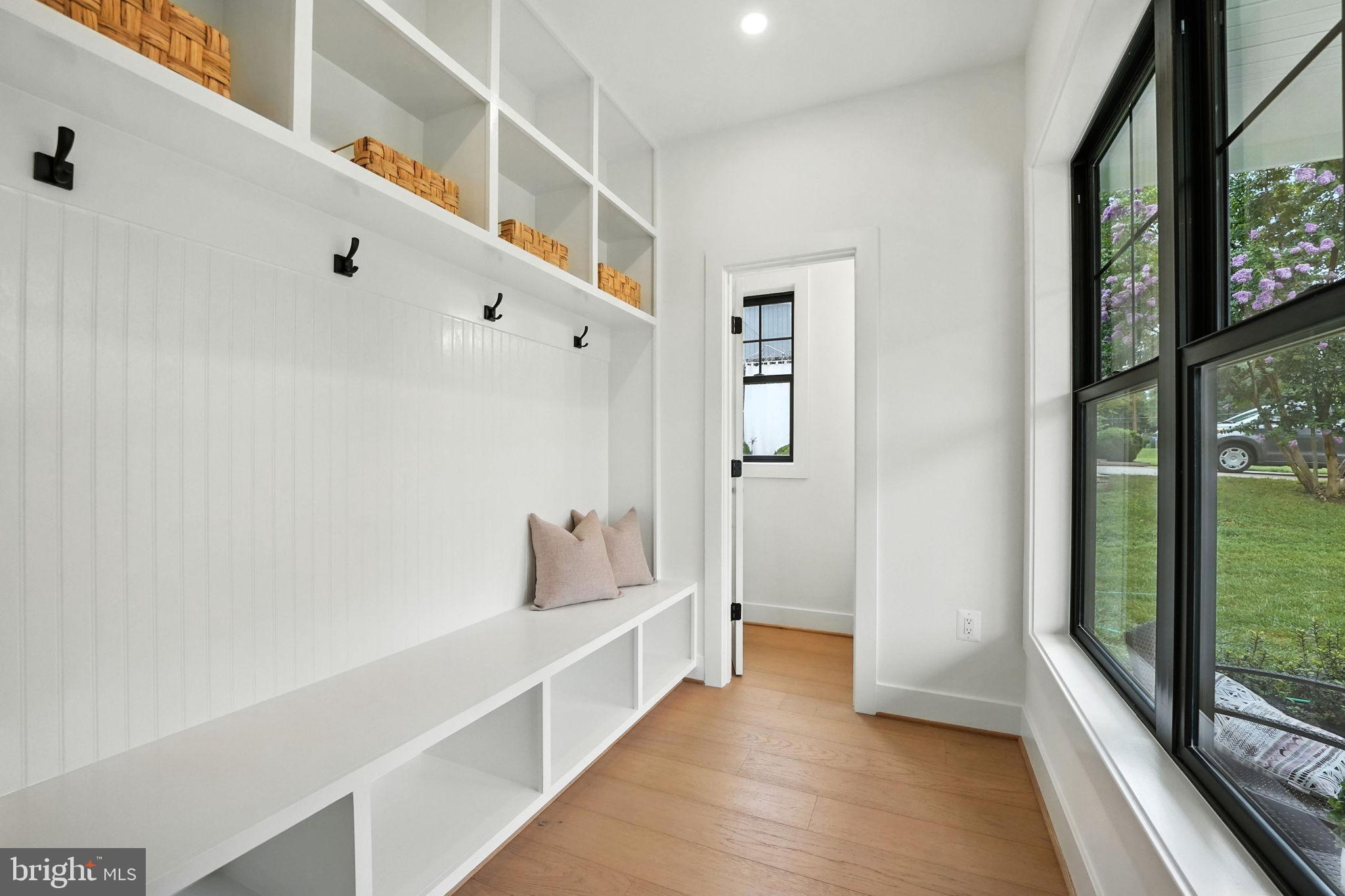 8118 Drayton Lane Springfield, VA 22151 - Photo 7 of 71 a hallway with white walls and windows